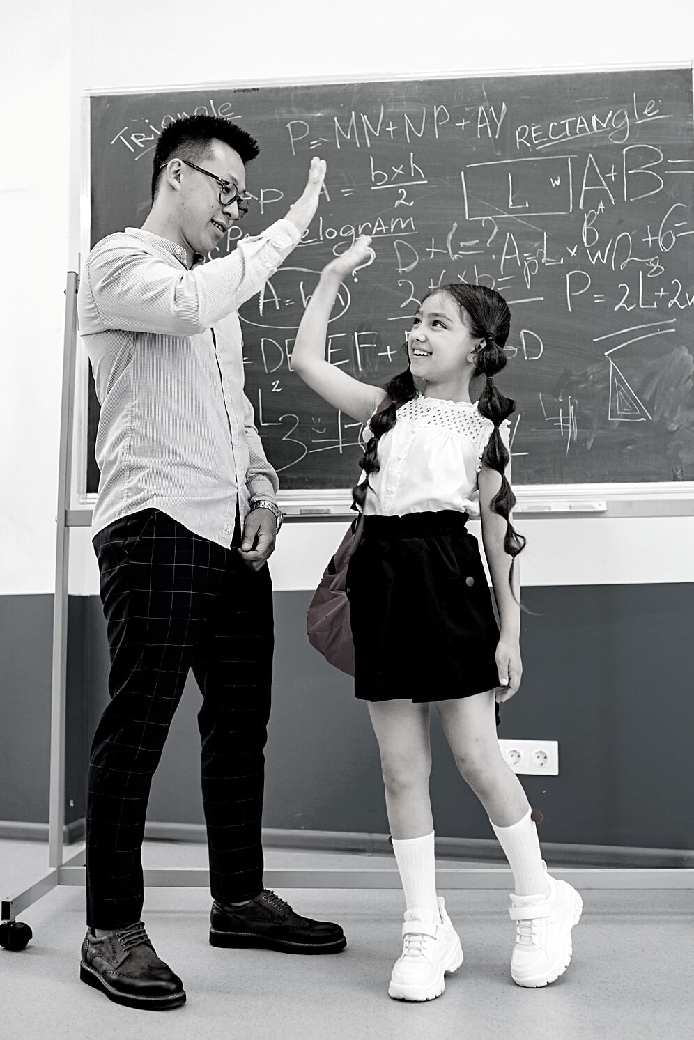 Man Giving a Girl a High Five